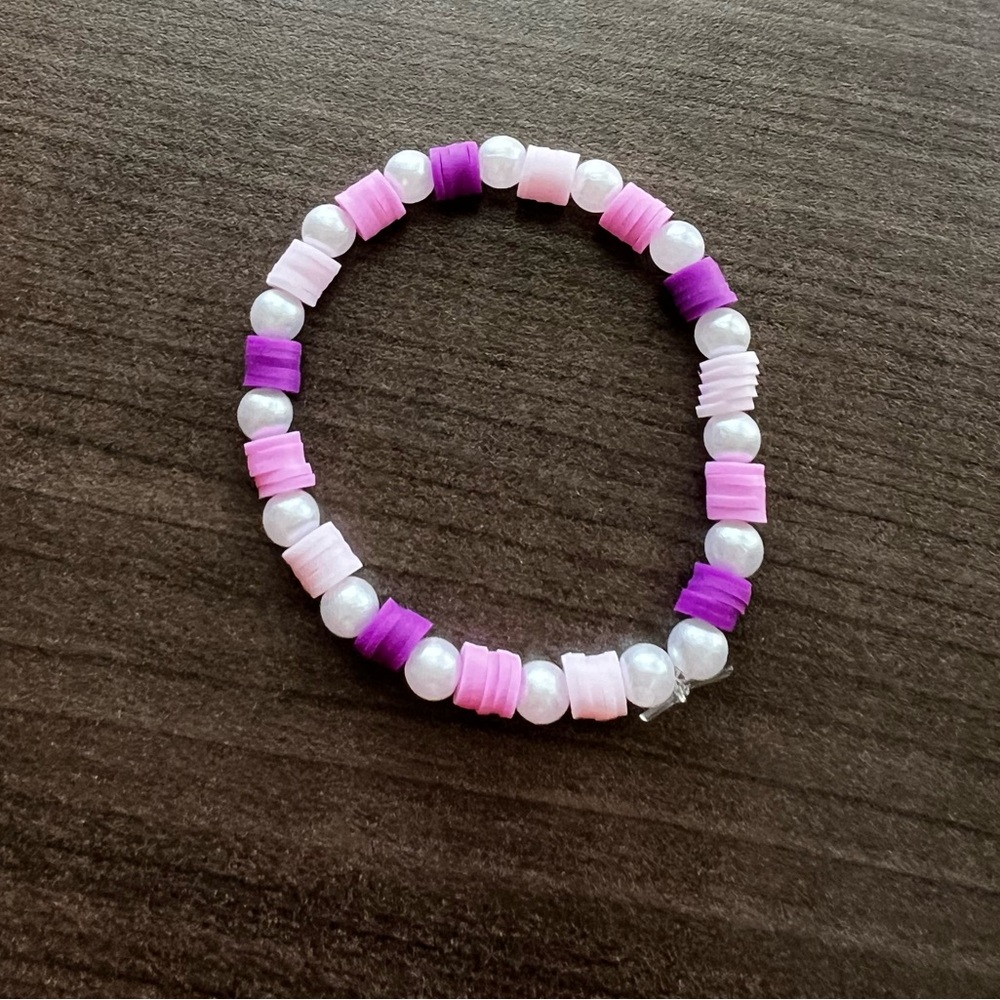 Handmade clay bead shades of purple with pearl accents bracelet